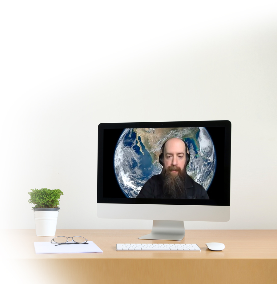 man on computer screen with earth background