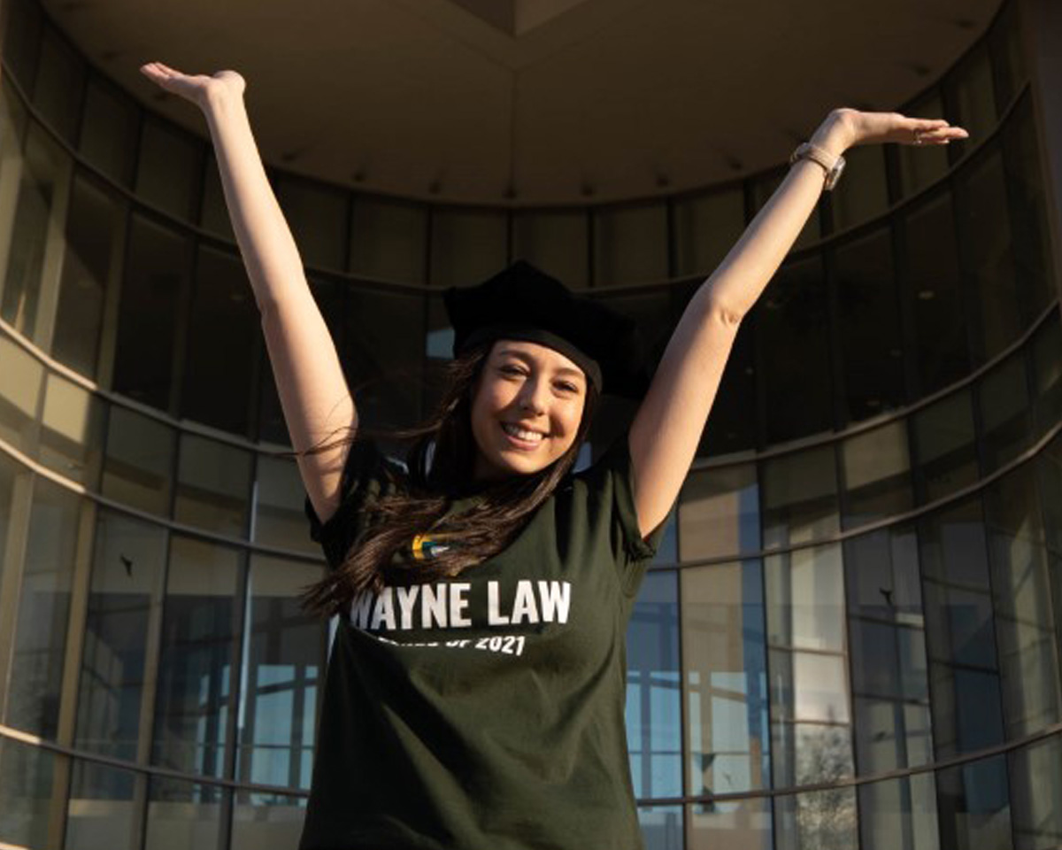 Molly Moss photographed smiling in a Wayne Law class of 2021 shirt