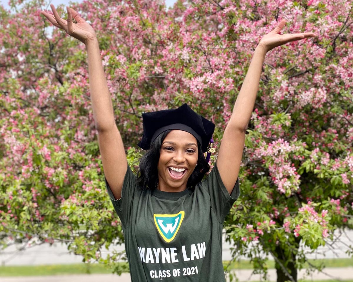 Morgan Jones photographed smiling in a Wayne Law class of 2021 shirt