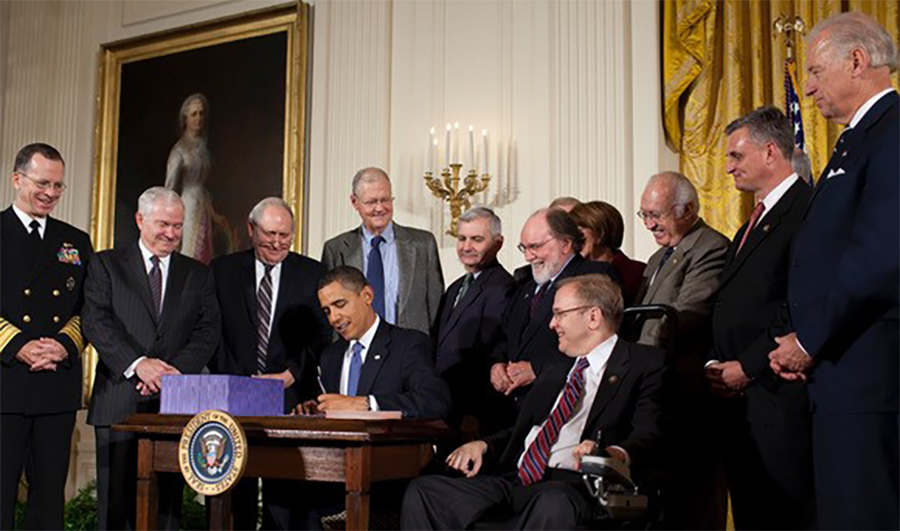 Barack Obama signing a bill
