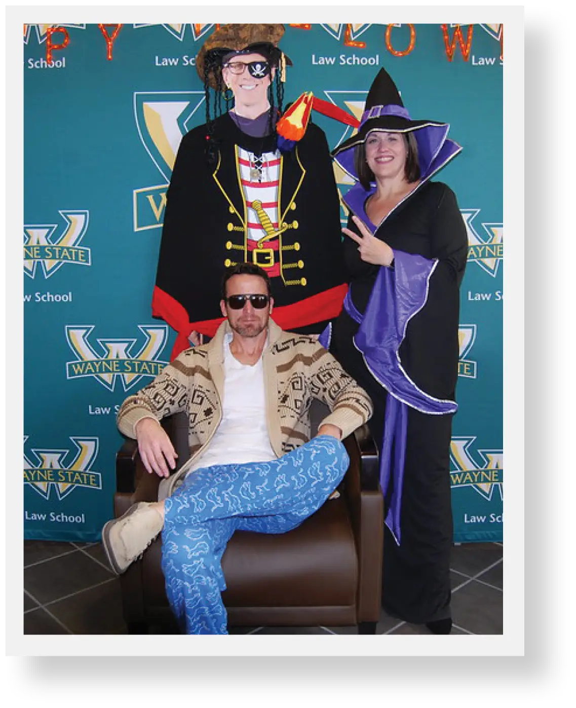 Two faculty members posing for picture during halloween party dressed in halloween costumes