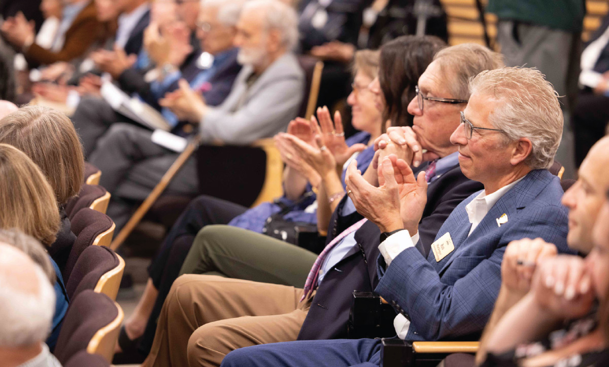 seated audience clapping