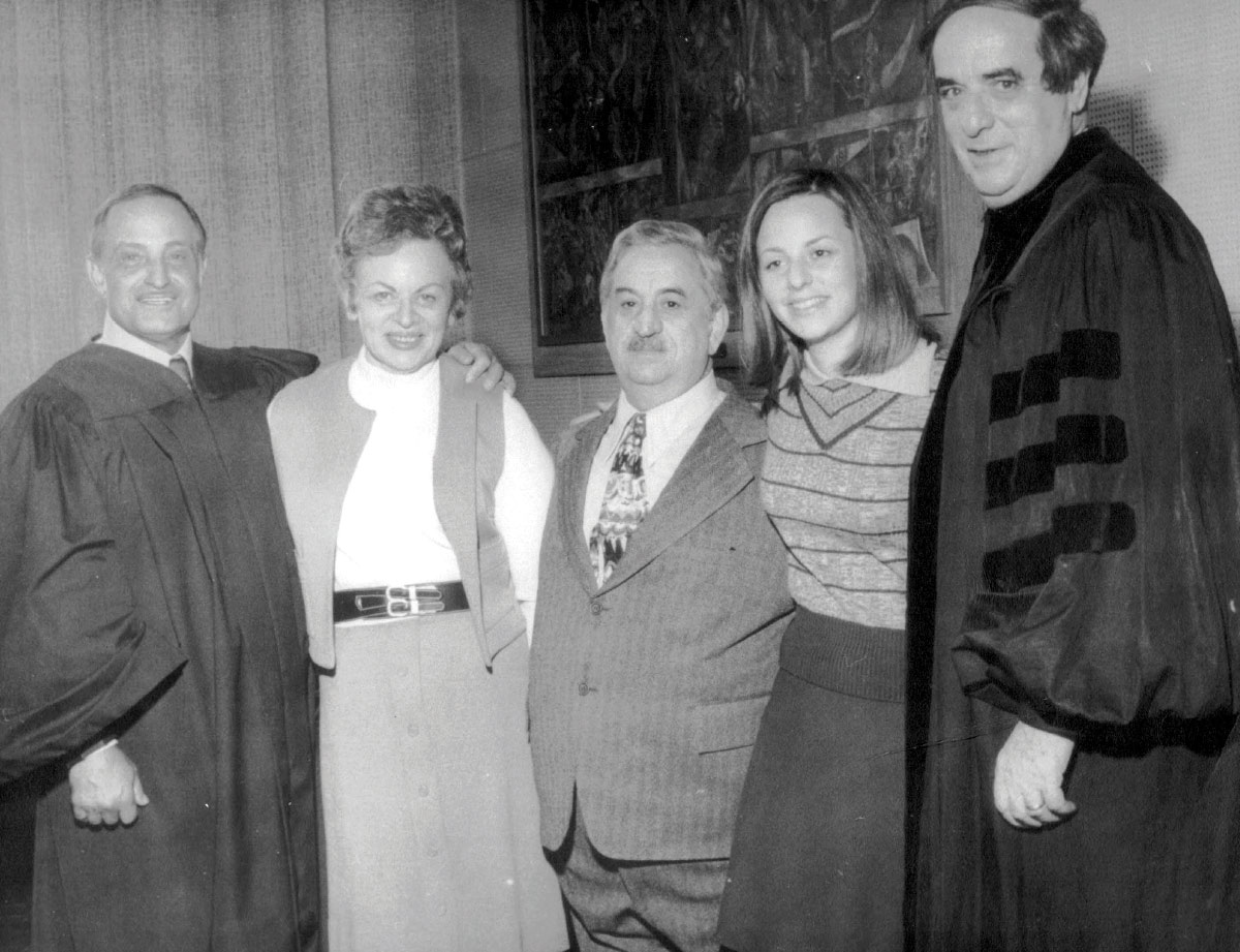  Black and white vintage photo of five adults standing together
